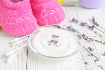 Obraz na płótnie Canvas baby organic cream with lavender on shelf in bathroom
