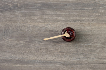 Jam in a jar on wooden table
