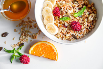 Breakfast with oatmeal and orange juice on white background