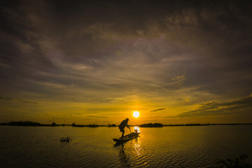 Fishermen in Inle lakes sunset, Myanmar. Fishermen is finish a day of fishing in Inle lake, Myanmar (Burma). Inle is one of the most favorite tourist places in Myanmar (Burma)