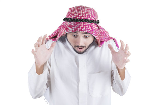 Shocked arabian man in studio