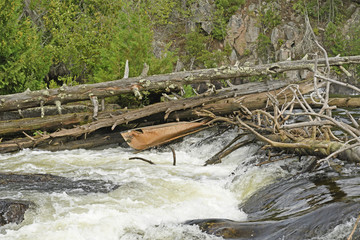 Broken Canoe in a Waterfall