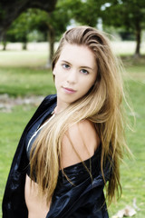 Naklejka premium Attractive Caucasian Teen Girl In Park Exercise Top