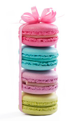 Collection of brightly colored French macaroons on white background