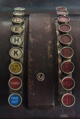 Rows of Keys on Heavily Used Antique Cash Register with Buttons for Dollar Amount, Received on Account, Charge and Paid Out