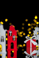 new year postcard with toy houses and gift box;