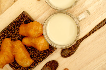 Served breakfast with deep-fried dough stick and Soybean milk in the morning with Flat-lay perspective view