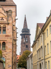 Fototapeta premium Clock tower of Freiburg minster cathedral