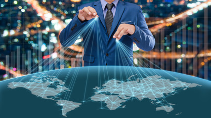 businessman in blue suite control the world with business graph