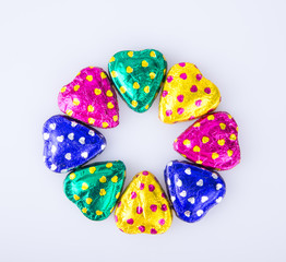 Chocolate or Colorful heart shape chocolate on a background.