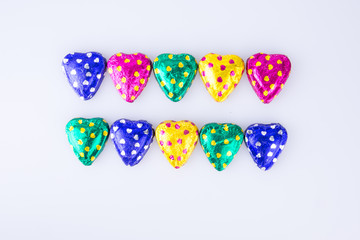 Chocolate or Colorful heart shape chocolate on a background.