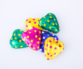 Chocolate or Colorful heart shape chocolate on a background.