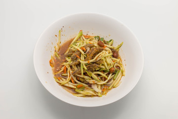 spicy mango salad in white dish isolated