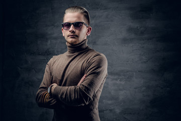 Fototapeta premium A man in sunglasses in turtle-neck sweate.