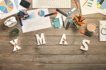 Word - Xmas on the wooden desk with different annual reports