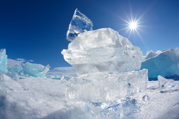Ice floe crystal and sun over Baikal lake
