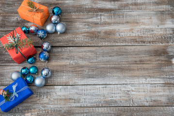 Christmas decorations on a wooden background, top view with copy