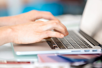 Image of woman's hands typing