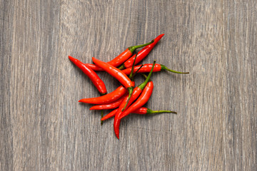 Red hot chilli pepper on wooden table