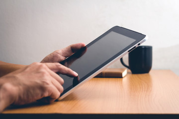 Smartphone or tablet computer male hand touching screen, vintage