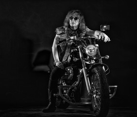 Fototapeta na wymiar Biker on a motorcycle.