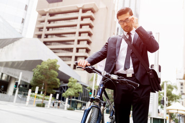 Young businessmen with a bike