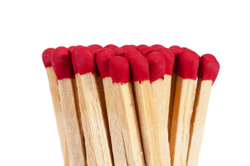 Heap of matches with rad heads isolated on white background