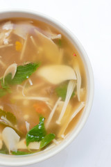 Hot and Spicy Soup with mushroom, mix vegetable and Thai herbs in white bowl on white background ,Vegetarian Food, Healthy food