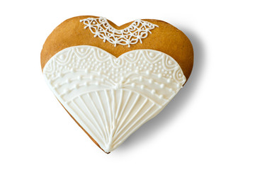 Wedding dress heart cookie. Biscuit with white glaze. Small surprise for a bride. Taste of holiday.