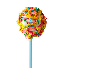 Dessert on stick. White glaze and sprinkles. Try the sweet masterpiece. Candy with soft filling.