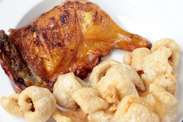 Streaky pork with crispy crackling and Grilled chicken leg . close-up. horizontal view from above. Thai Food