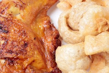 Streaky pork with crispy crackling and Grilled chicken leg . close-up. horizontal view from above. Thai Food