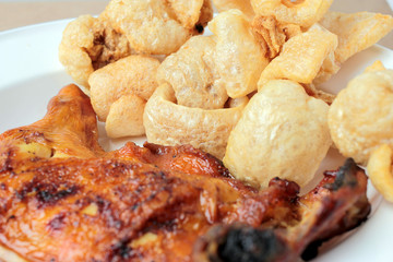 Streaky pork with crispy crackling and Grilled chicken leg . close-up. horizontal view from above. Thai Food
