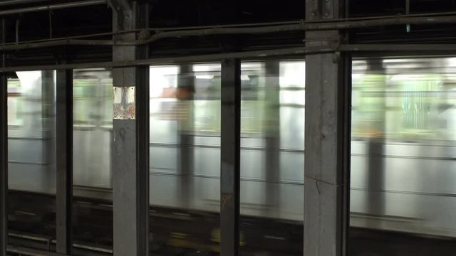 Seamless loop NYC subway train background video, motion blur, can be repeated as long as you need it, for travel backgrounds or green screen replacements