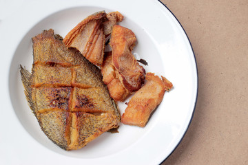 The fried in white dish on wooden background, delicious thai food