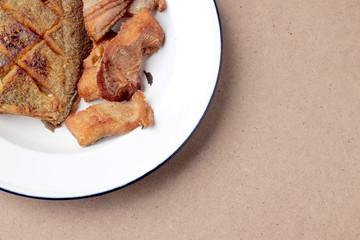 The fried in white dish on wooden background, delicious thai food