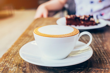 close up coffee on wood table in coffee shop cafe