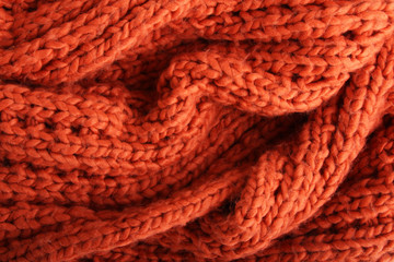 Close-up of a piece of orange knit fabric