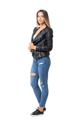 Fototapeta premium Pretty female fashion model in casual clothes posing at camera. Full body length portrait isolated over white background