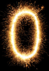 Sparkler firework light alphabet O and number zero isolated on black