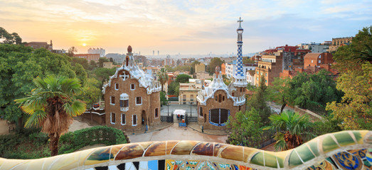 Fototapeta na wymiar Park Guell in Barcelona. View to entrace houses with greenery on foreground