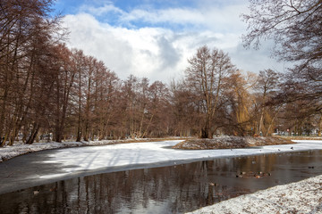 Fototapeta na wymiar Pond in the park in winter time.