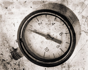 The old vintage measuring device with a scale from 0 to 10, and the arrow is stuck at zero. Stylised as aged old b&w photos. Industrial background.