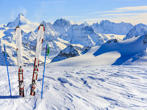   Ski equipment with amazing view of swiss famous mountains in b