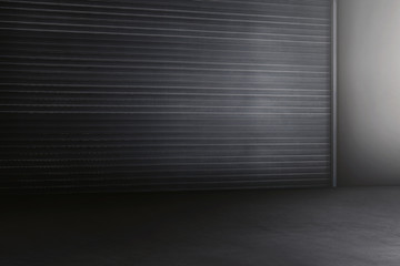Old metal rolling door in dark style