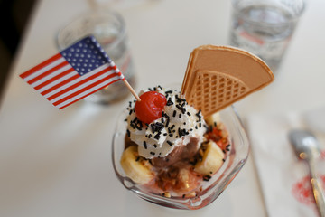 banana ice cream decorated cherry in cafe
