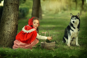 Red Riding Hood and gray wolf in the forest