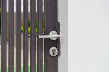 metallic door handle on metallic door