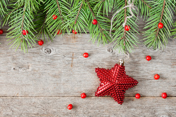 Fir branch with berries and Christmas star