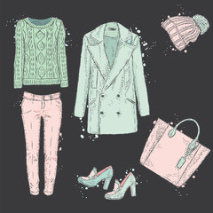 A set of fashionable women's clothing. Coats, shoes, bags, pants and hat. Wool sweater. Vector illustration. Fashion sketch. Selection of clothes for autumn-spring.